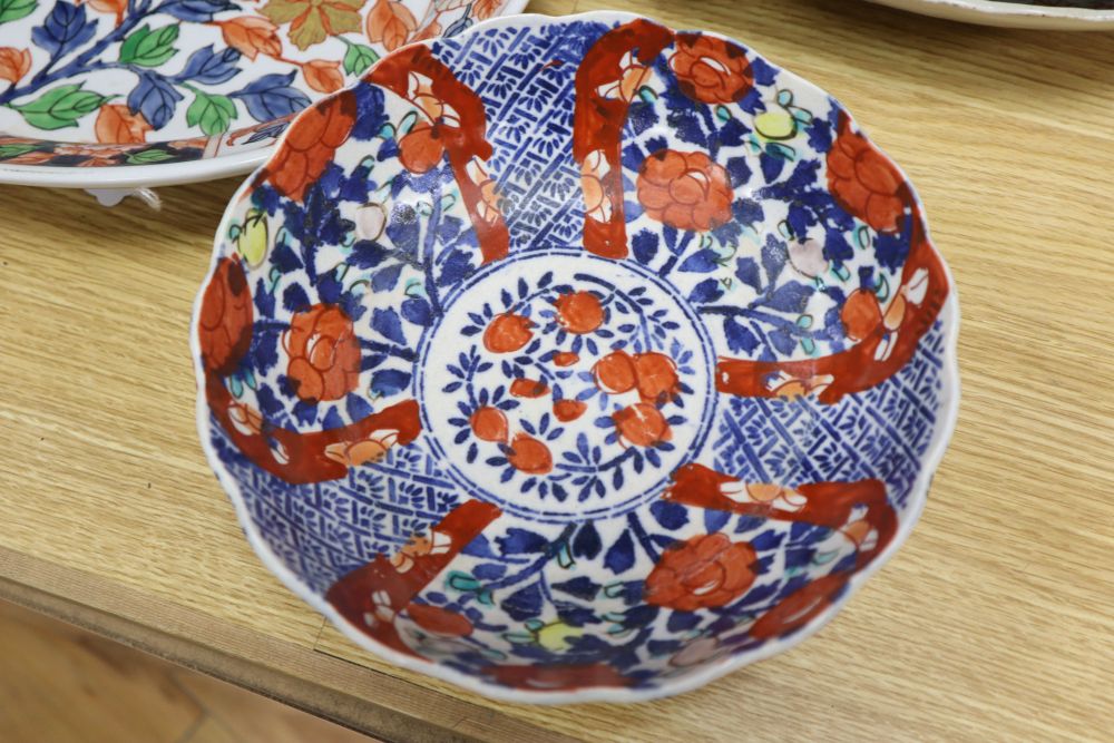 A Japanese Imari oval dish with six-character mark to base and six other items of Japanese Imari